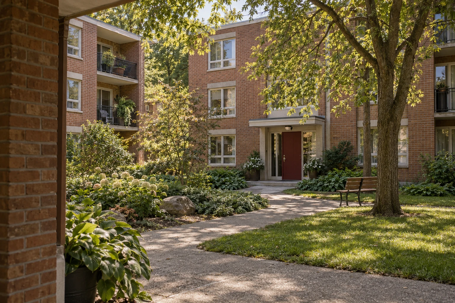 An illustrative rental courtyard framed by brick and greenery